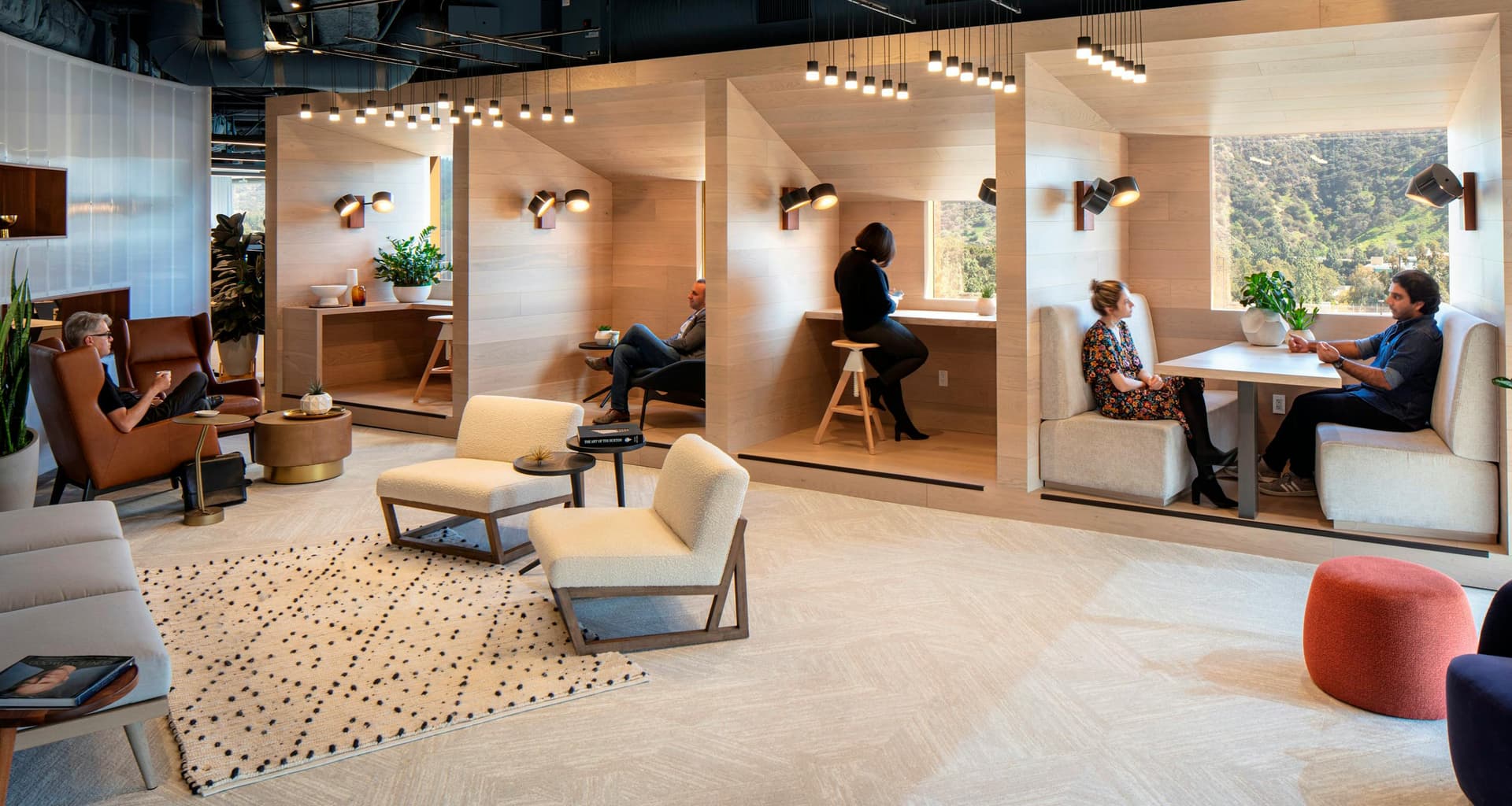 Wood-clad focus booths overlooking hillside views